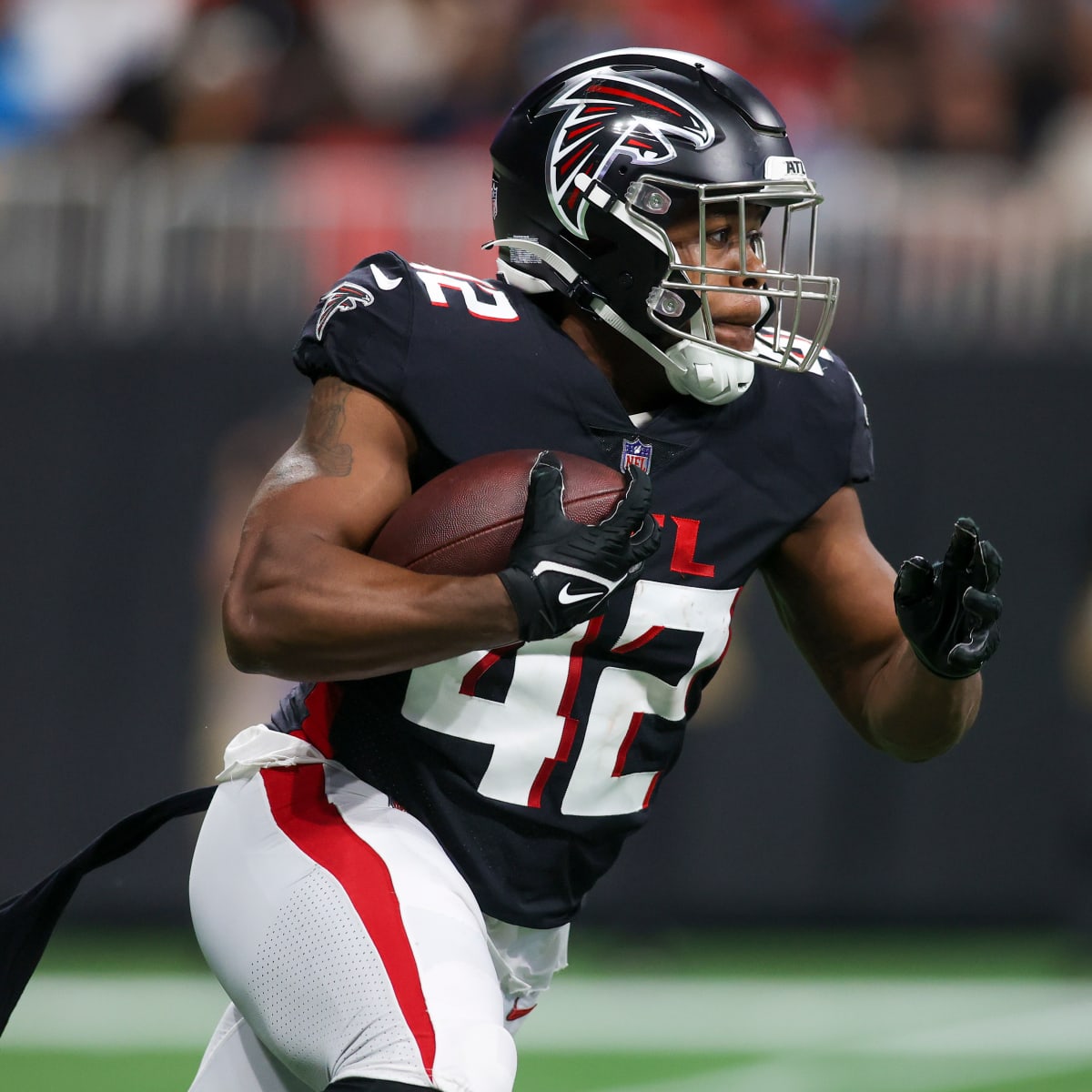 Atlanta Falcons running back Caleb Huntley (42) runs against the San  Francisco 49ers during the first half of an NFL football game, Sunday, Oct.  16, 2022, in Atlanta. (AP Photo/John Bazemore Stock