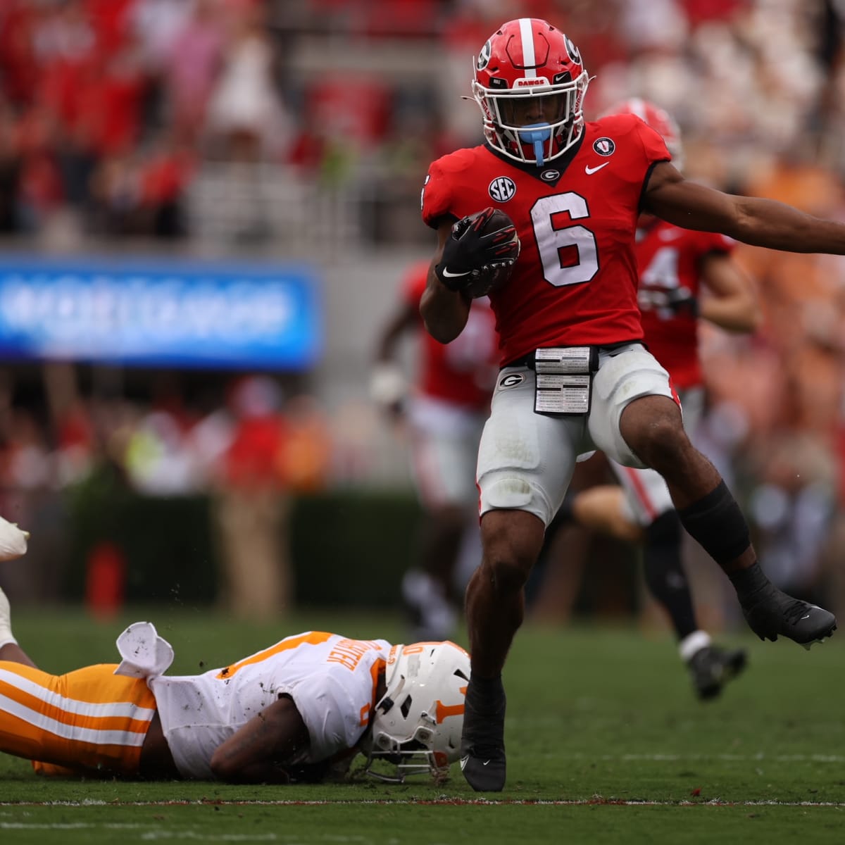 D'Andre Swift Georgia Bulldogs Unsigned White Jersey Running Photograph