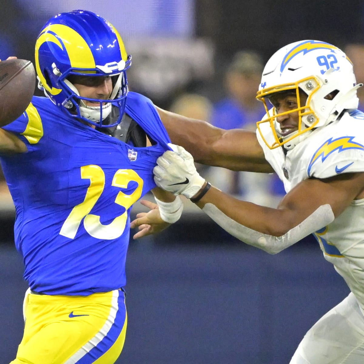 Los Angeles Rams safety Jason Taylor II, right, runs a play