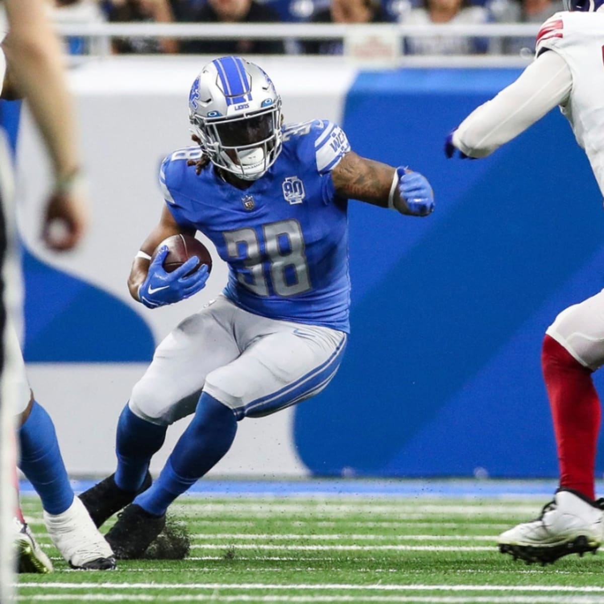 Detroit Lions running back Devine Ozigbo (30) watches from the