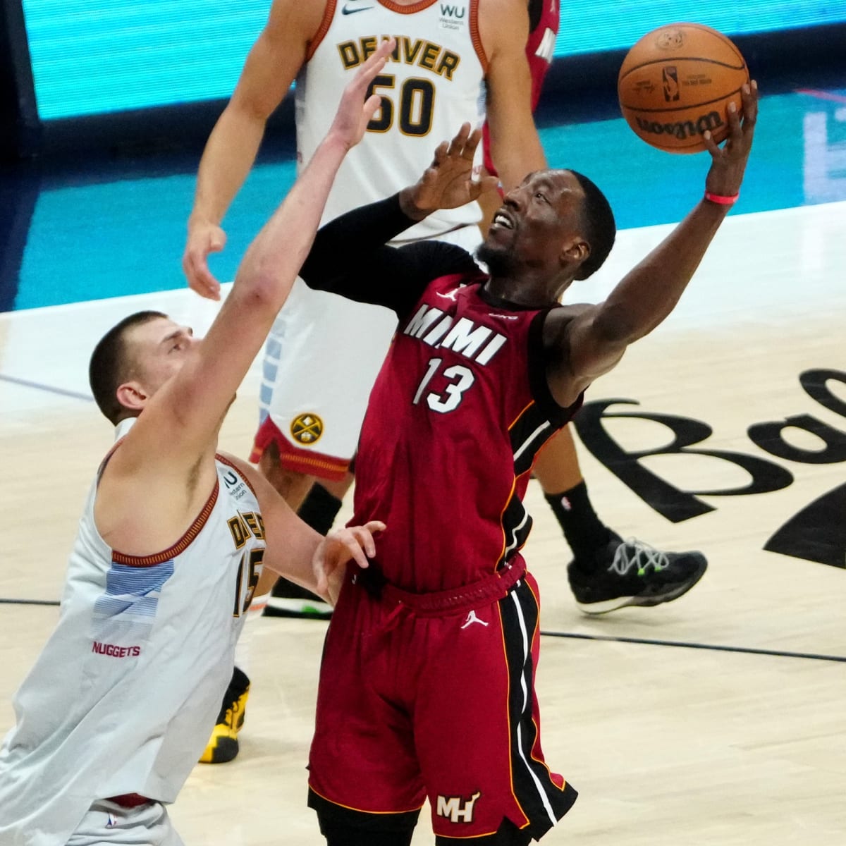 Miami Heat's Bam Ado (13) grabs a rebound next to Miami Heat's