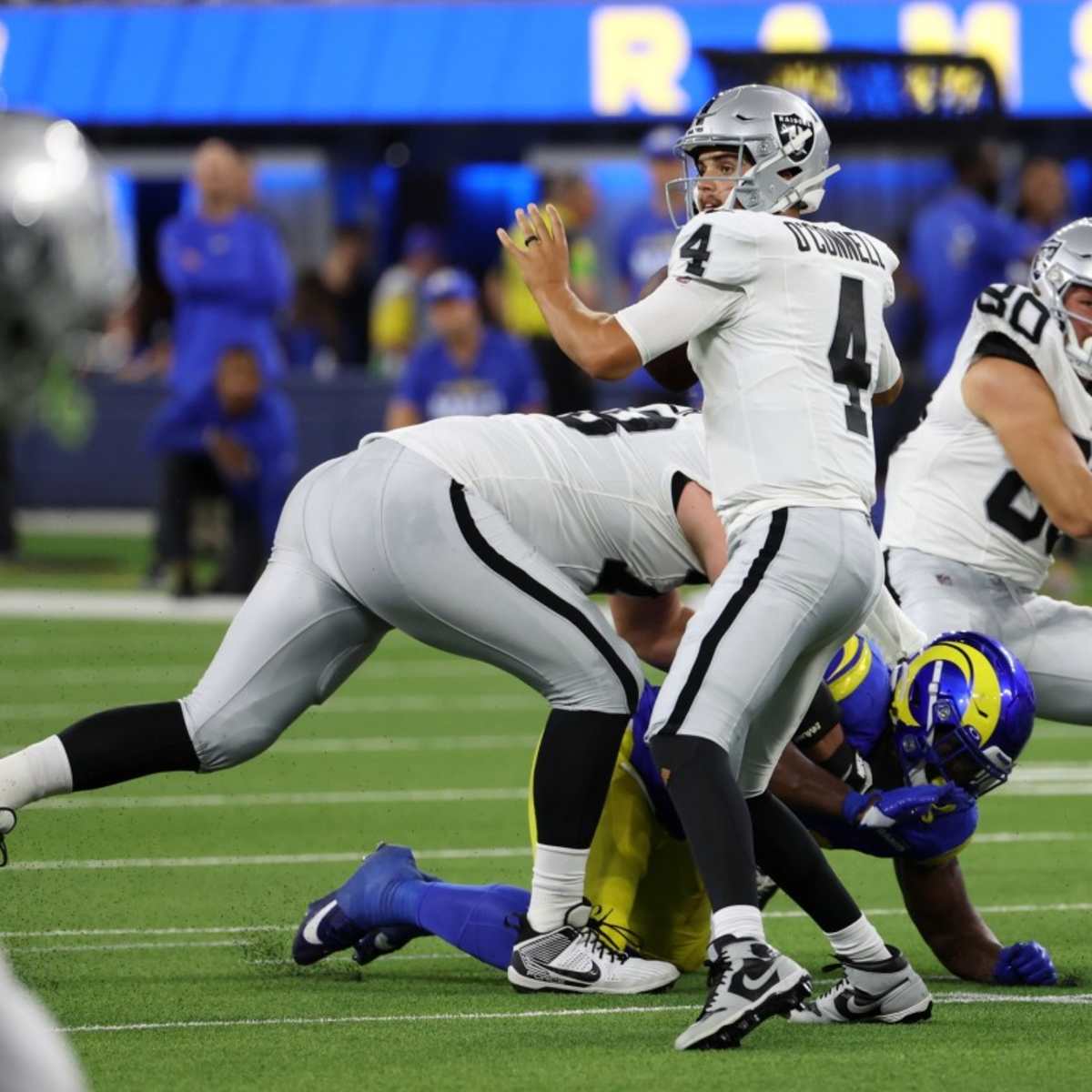 Las Vegas Raiders quarterback Aidan O'Connell (4) gestures as he warms up  before the first half of a preseason NFL football game against the Dallas  Cowboys in Arlington, Texas, Saturday, Aug. 26