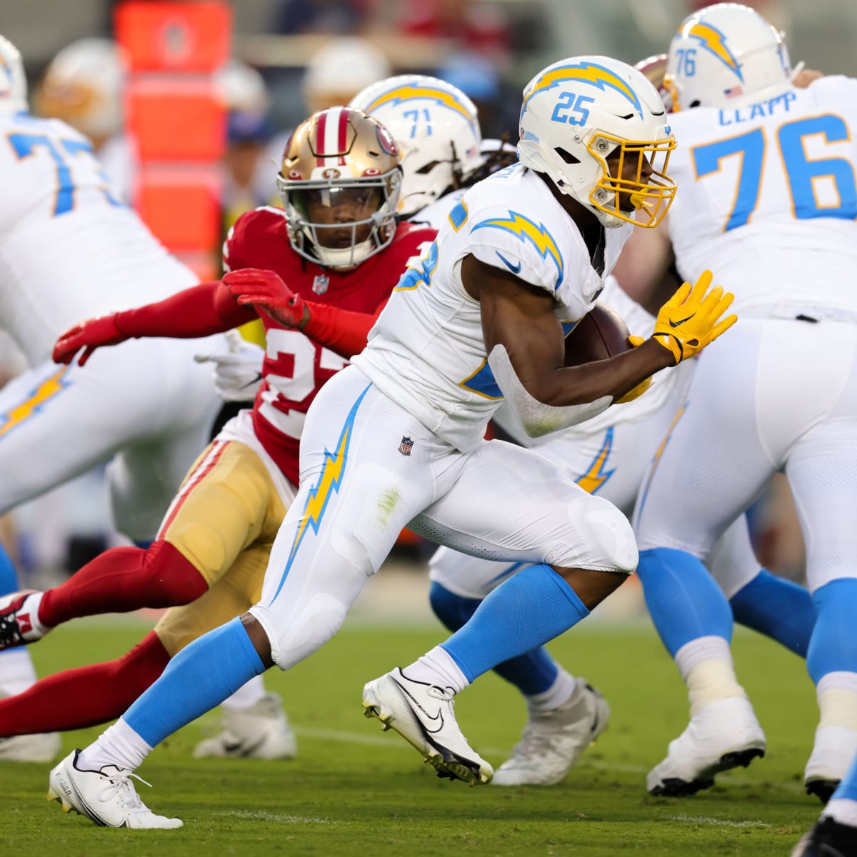 Los Angeles Chargers running back Joshua Kelley (25) carries against the  Los Angeles Rams during the first half of a preseason NFL football game  Saturday, Aug. 12, 2023, in Inglewood, Calif. (AP