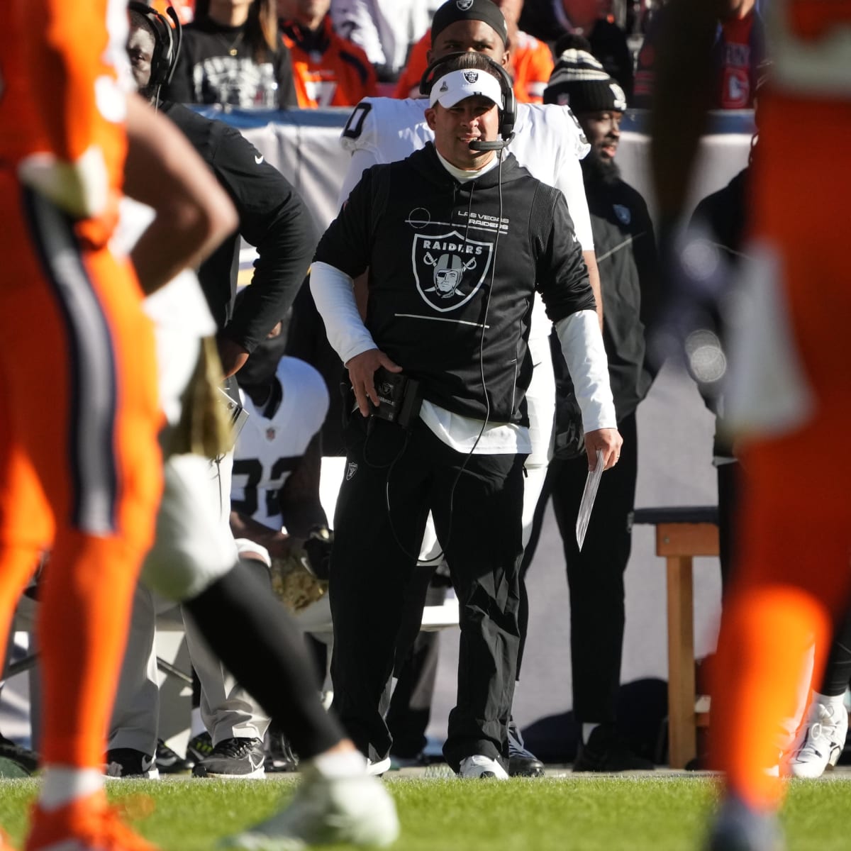 Las Vegas Raiders head coach Josh McDaniels watches players warm up before  an NFL football game against the Denver Broncos in Denver, Sunday, Nov. 20,  2022. (AP Photo/David Zalubowski Stock Photo - Alamy