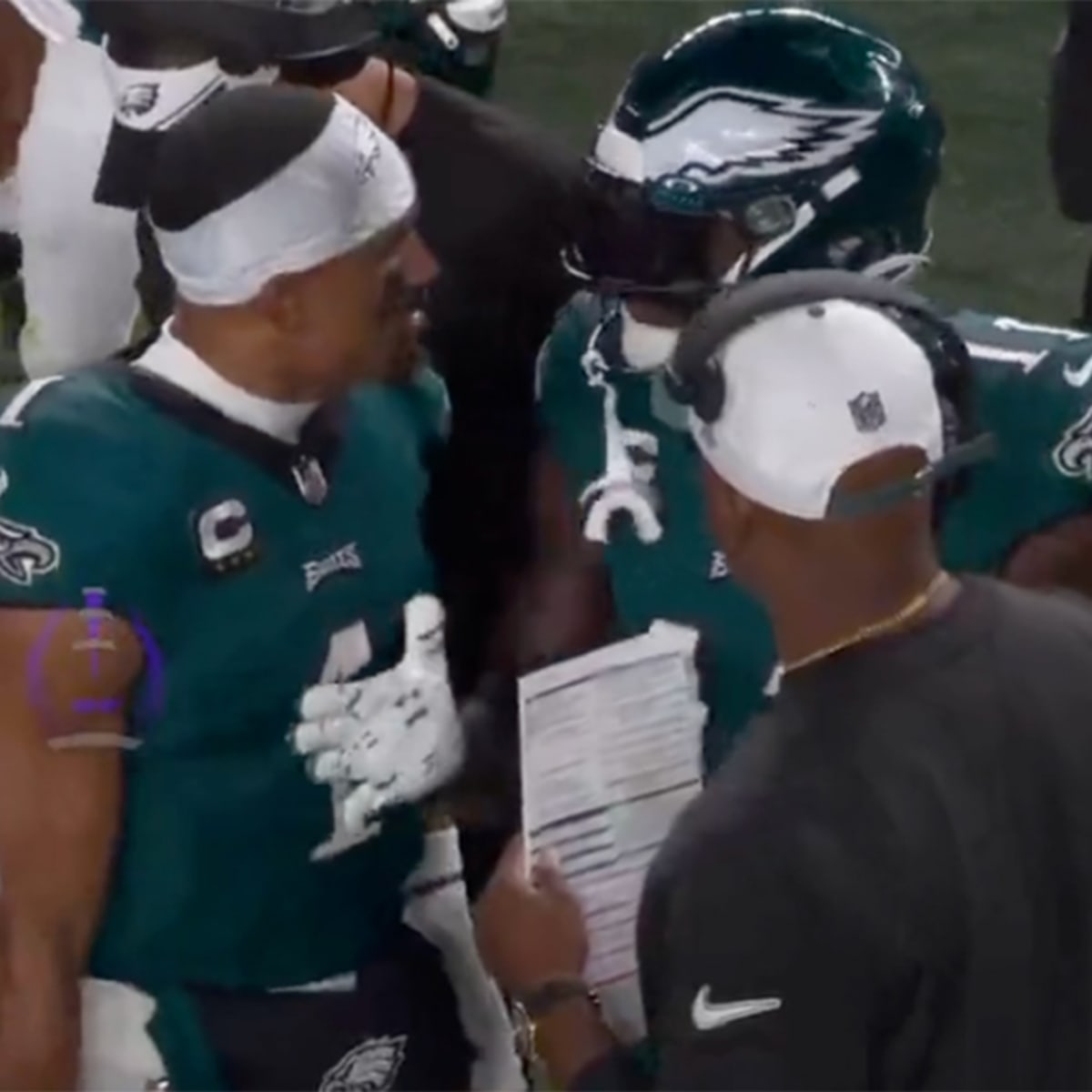 Philadelphia Eagles wide receiver A.J. Brown (11) and quarterback Jalen  Hurts (1) talk after an NFL