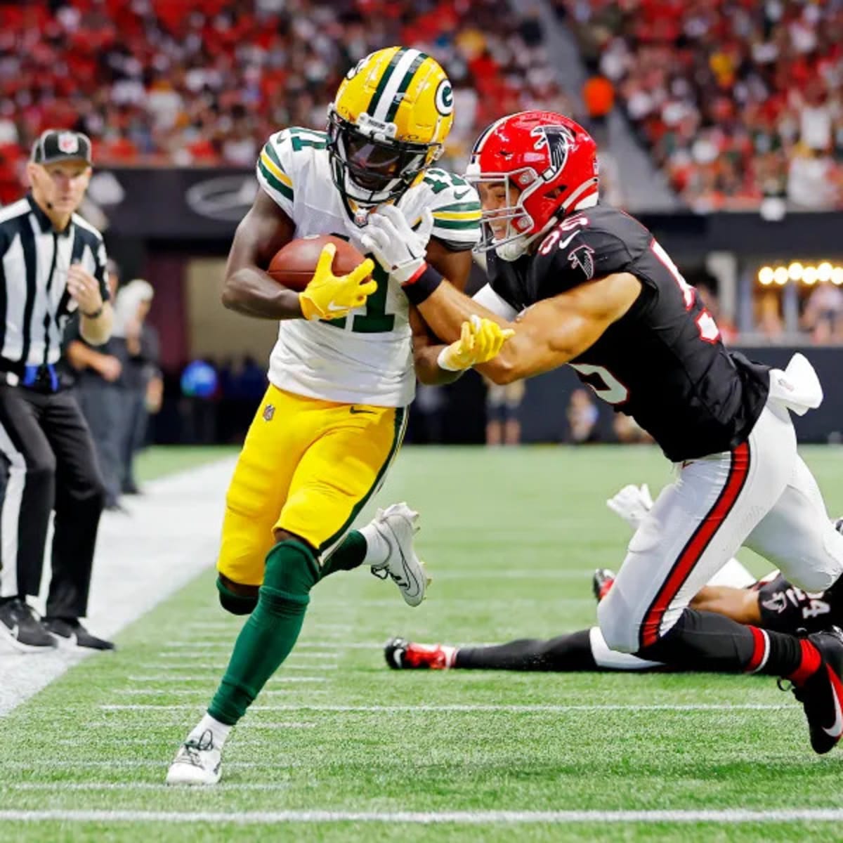 Green Bay Packers wide receiver Jayden Reed (11) scores a touchdown during  the first half of an NFL football game against the Atlanta Falcons, Sunday,  Sep. 17, 2023, in Atlanta. The Atlanta