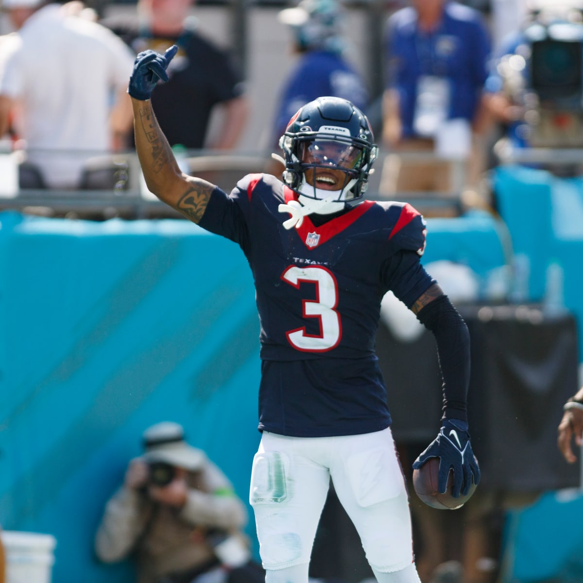 Houston Texans wide receiver Tank Dell makes his way to the field