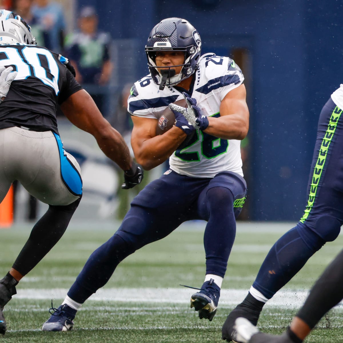 Seattle Seahawks running back Zach Charbonnet carries the ball