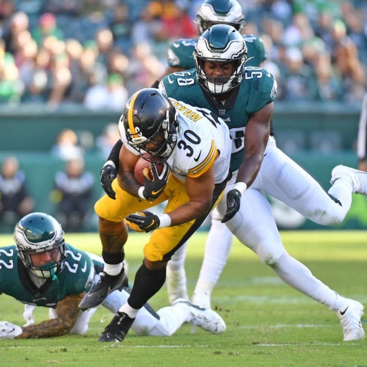 Philadelphia Eagles linebacker Kyron Johnson (58) drops back in