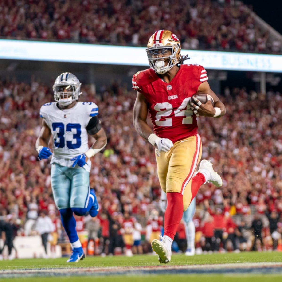 Jordan Mason of the San Francisco 49ers runs the ball during the