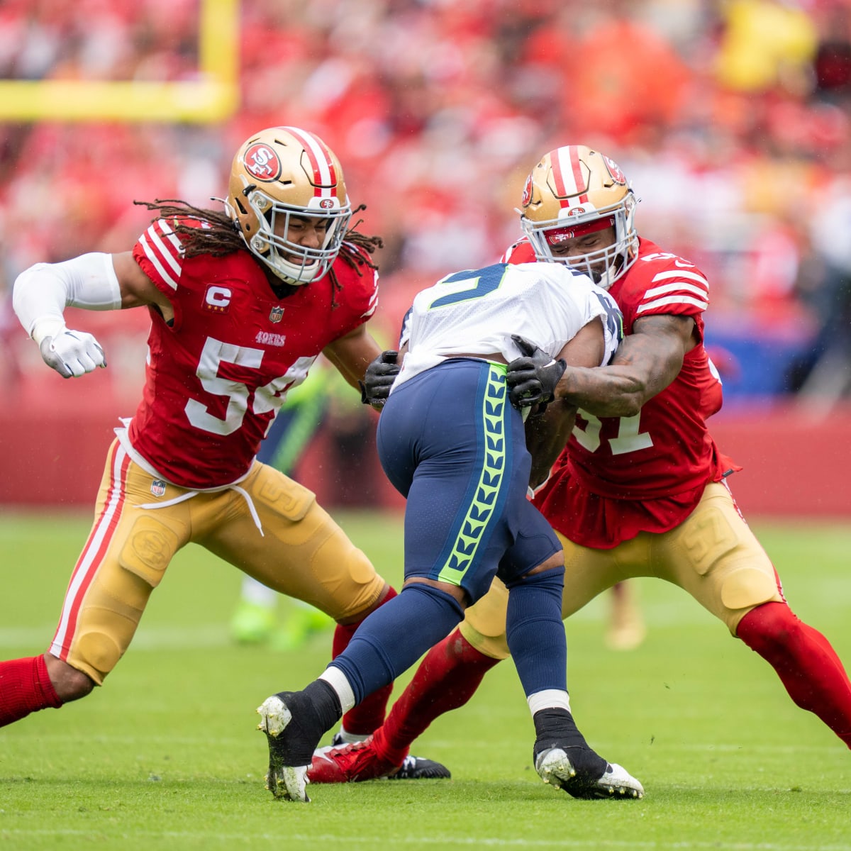 San Francisco 49ers linebacker Fred Warner (54) is tackled by
