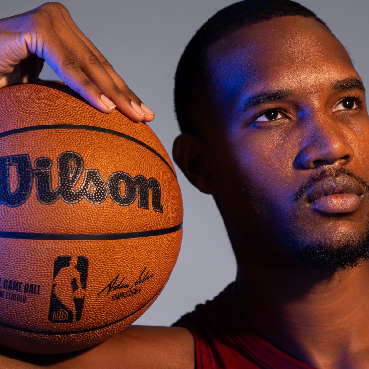 Cleveland Cavaliers GM Koby Altman, left hands Cavs first round draft  selection, Evan Mobley his new jersey during a news conference at the  Cavaliers training facility in Independence, Ohio, Friday, July 30