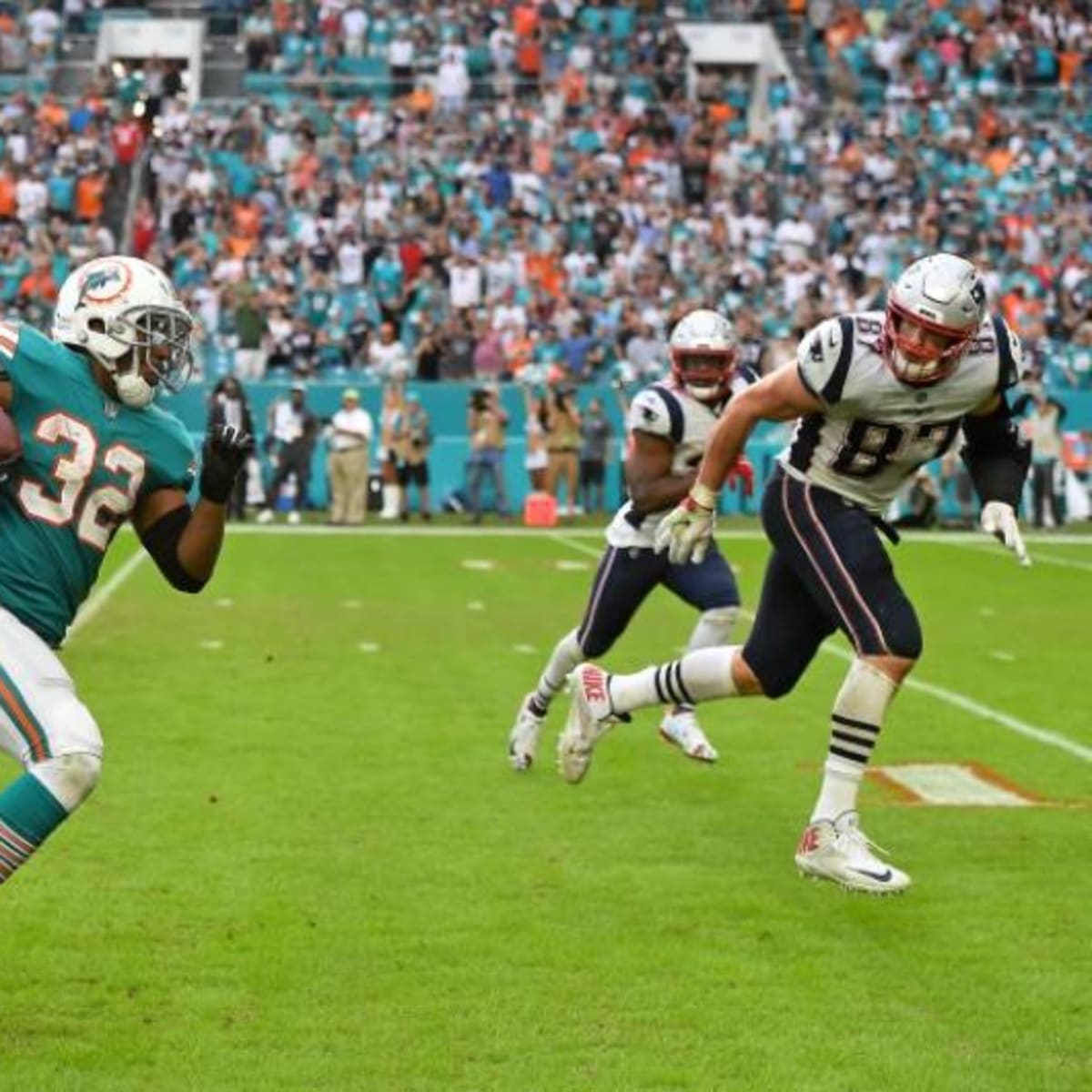 Miami Miracle': Baltimore Ravens' Running Back Kenyan Drake Throws Hoodie  Shade at New England Patriots - Sports Illustrated New England Patriots  News, Analysis and More