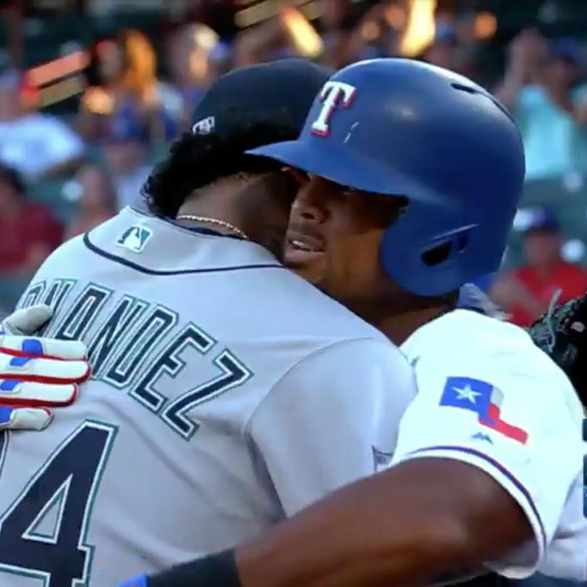 Former Seattle Mariners teammate Adrian Beltre, facing, hugs Félix