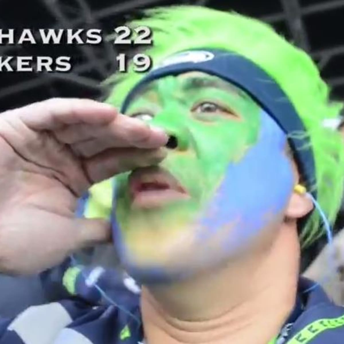 A Seattle Seahawks fan shows off her 12th Man boots before the start of a  game against the Green Bay Packers in the NFC Championship game at  CenturyLink Field in Seattle, Washington