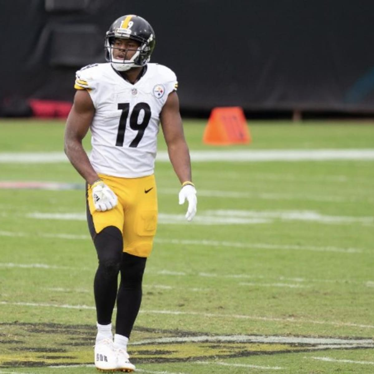 Pittsburgh Steelers wide receiver JuJu Smith-Schuster (19) is upended by  Denver Broncos safety Kareem Jackson (22) during the first half of an NFL  football game in Pittsburgh, Sunday, Oct. 10, 2021. Smith-Shuster