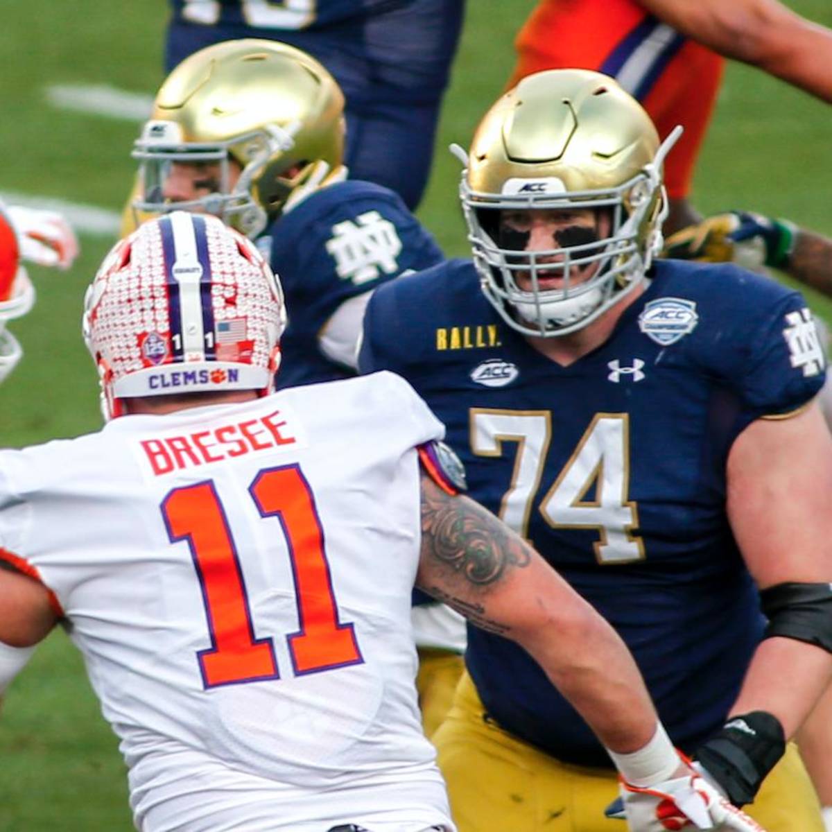 Notre Dame quarterback Ian Book and Liam Eichenberg celebrate a