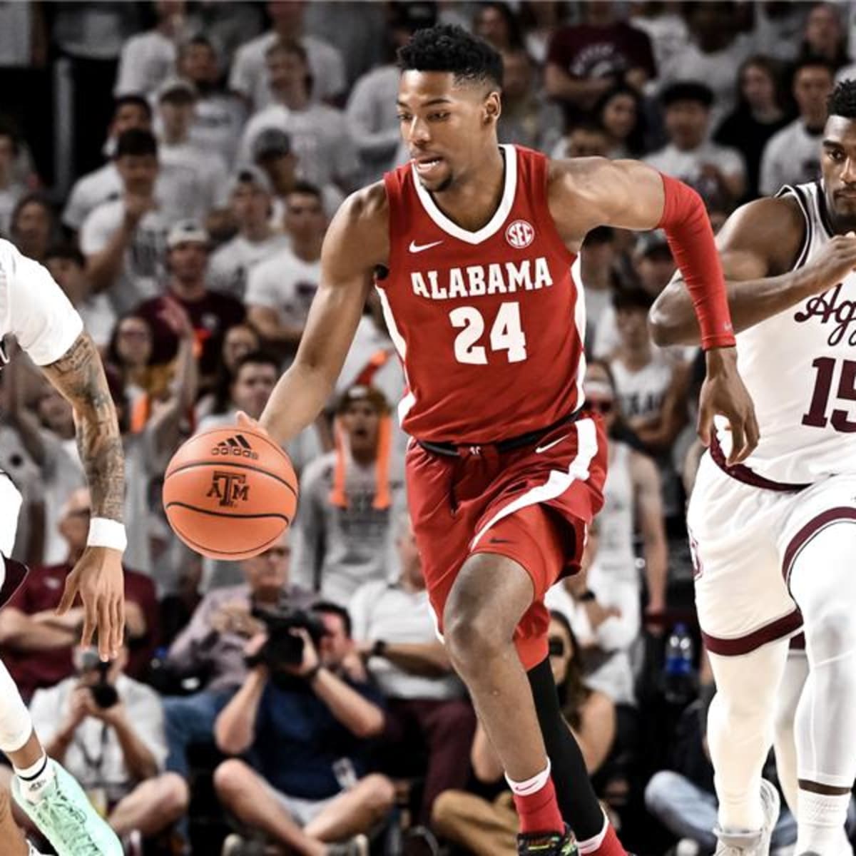 COLLEGE STATION, TX - MARCH 04: Alabama Crimson Tide guard Nimari Burnett  (25) drives from the wing during the basketball game between the Alabama  Crimson Tide and Texas A&M Aggies at Reed