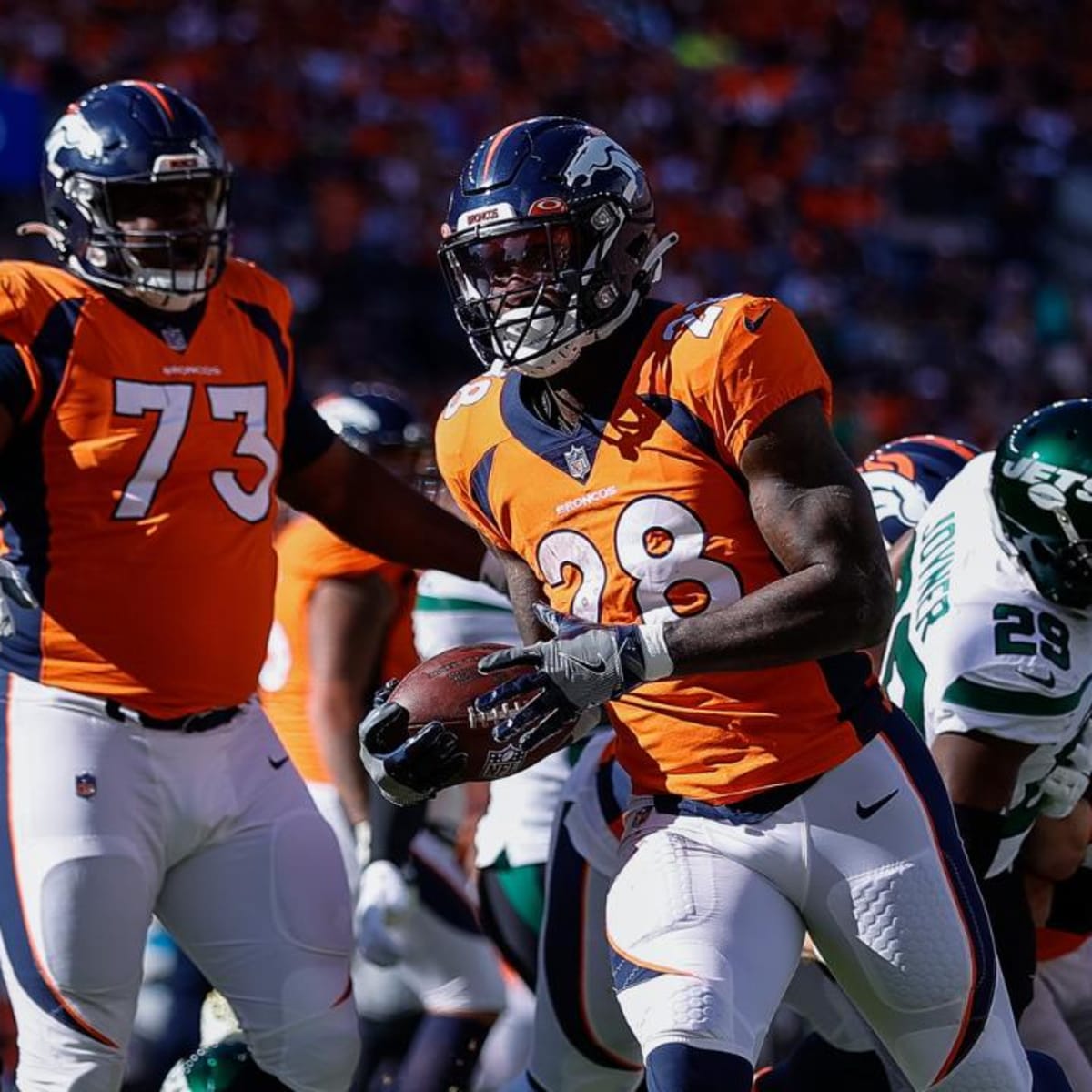 Denver Broncos offensive tackle Cam Fleming watchs the action from