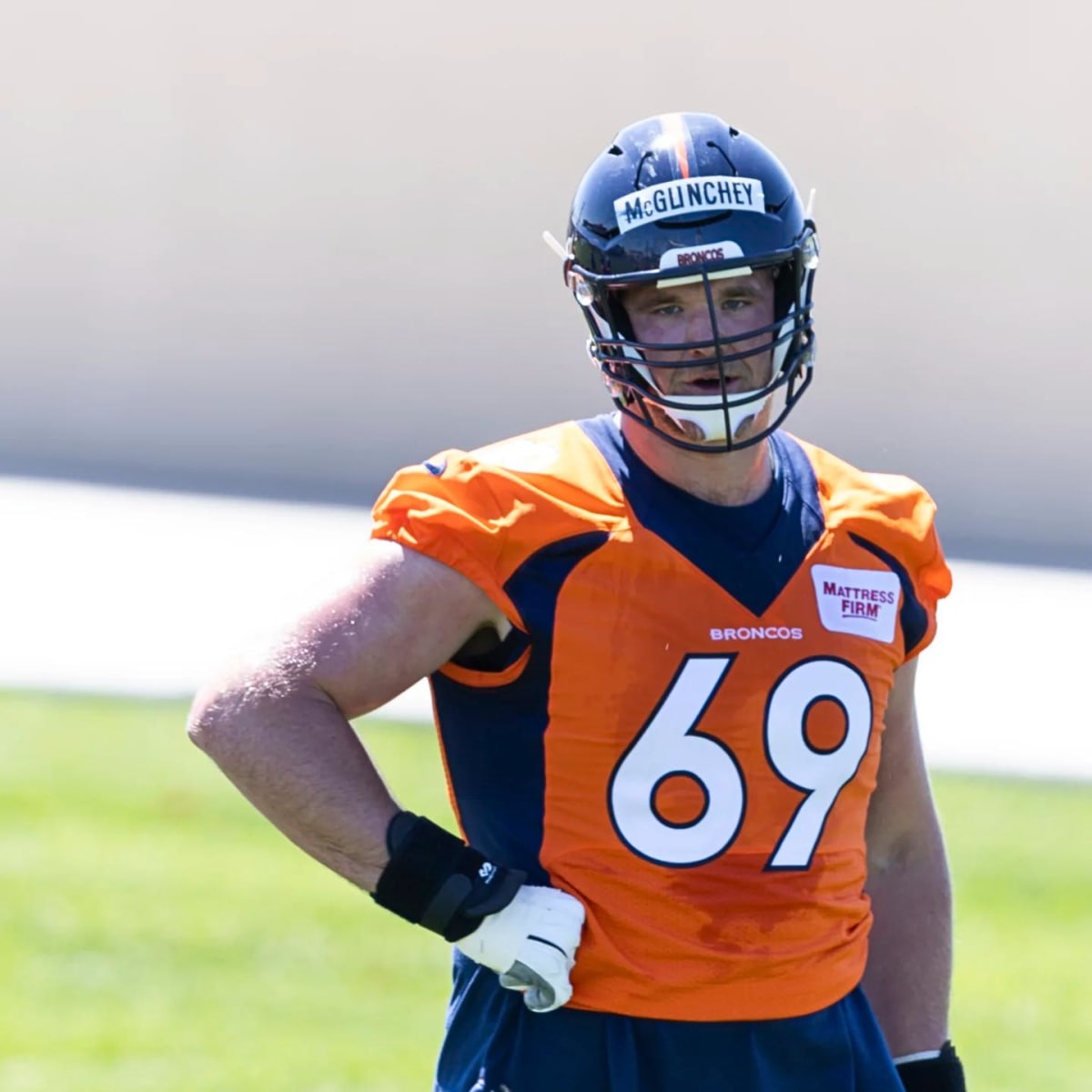 Denver Broncos offensive tackle Mike McGlinchey (69) lines up