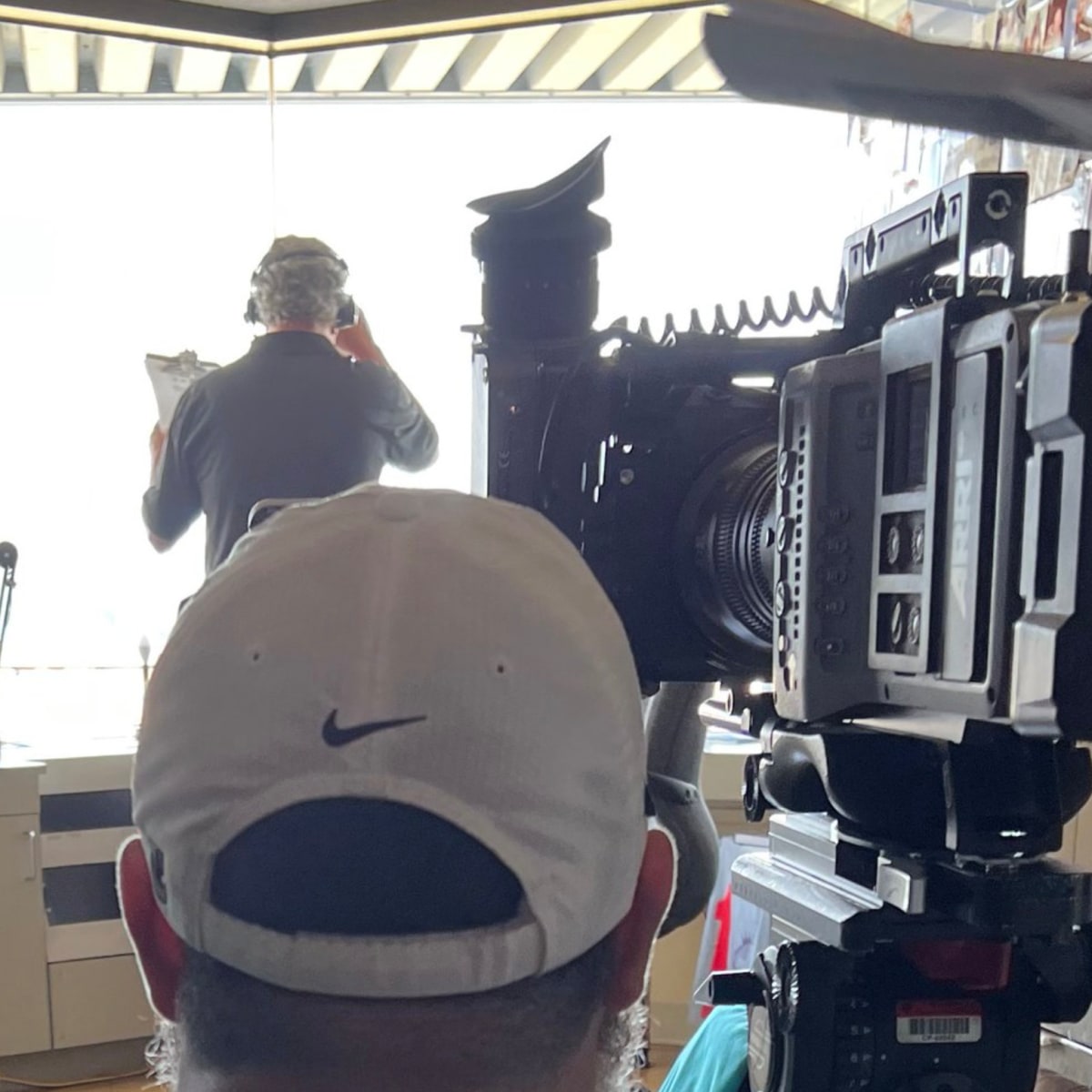 An NFL Films camera operator works during the first half of a