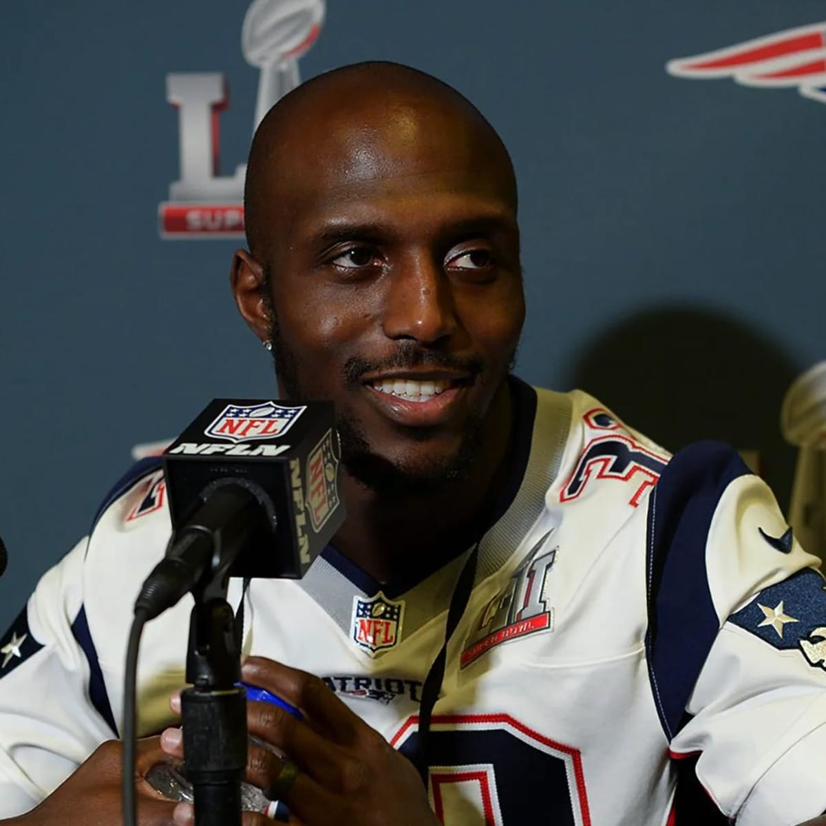 The Super Bowl 52 logo is worn on the jersey of New England Patriots free  safety Devin McCourty as McCourty answers questions during a news  conference Wednesday, Jan. 31, 2018, in Minneapolis.