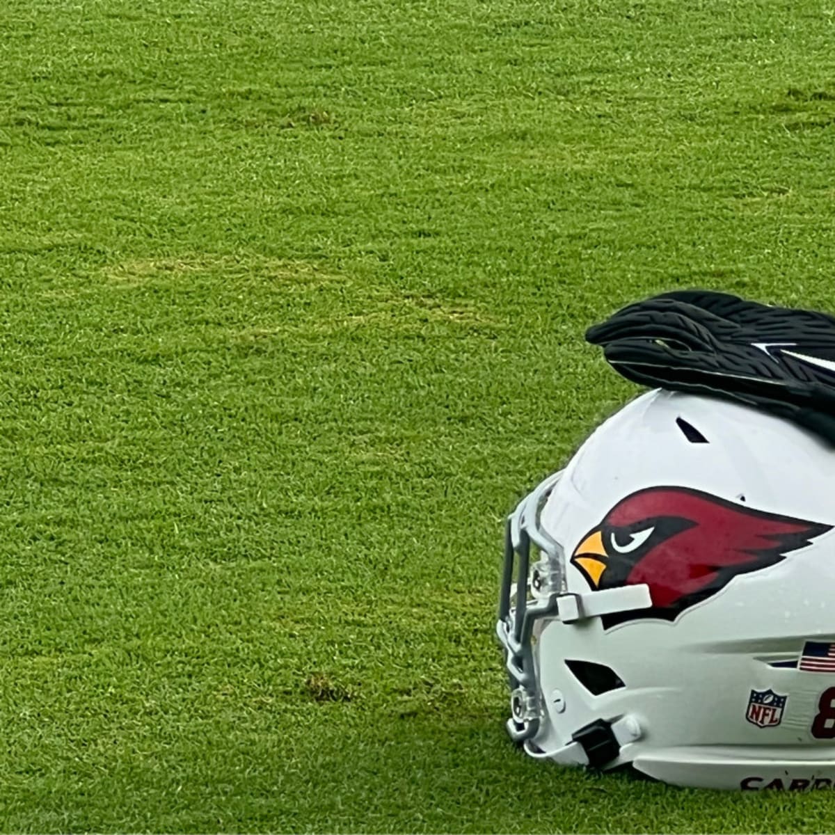 An Arizona Cardinals helmet on the grass during Arizona Cardinals