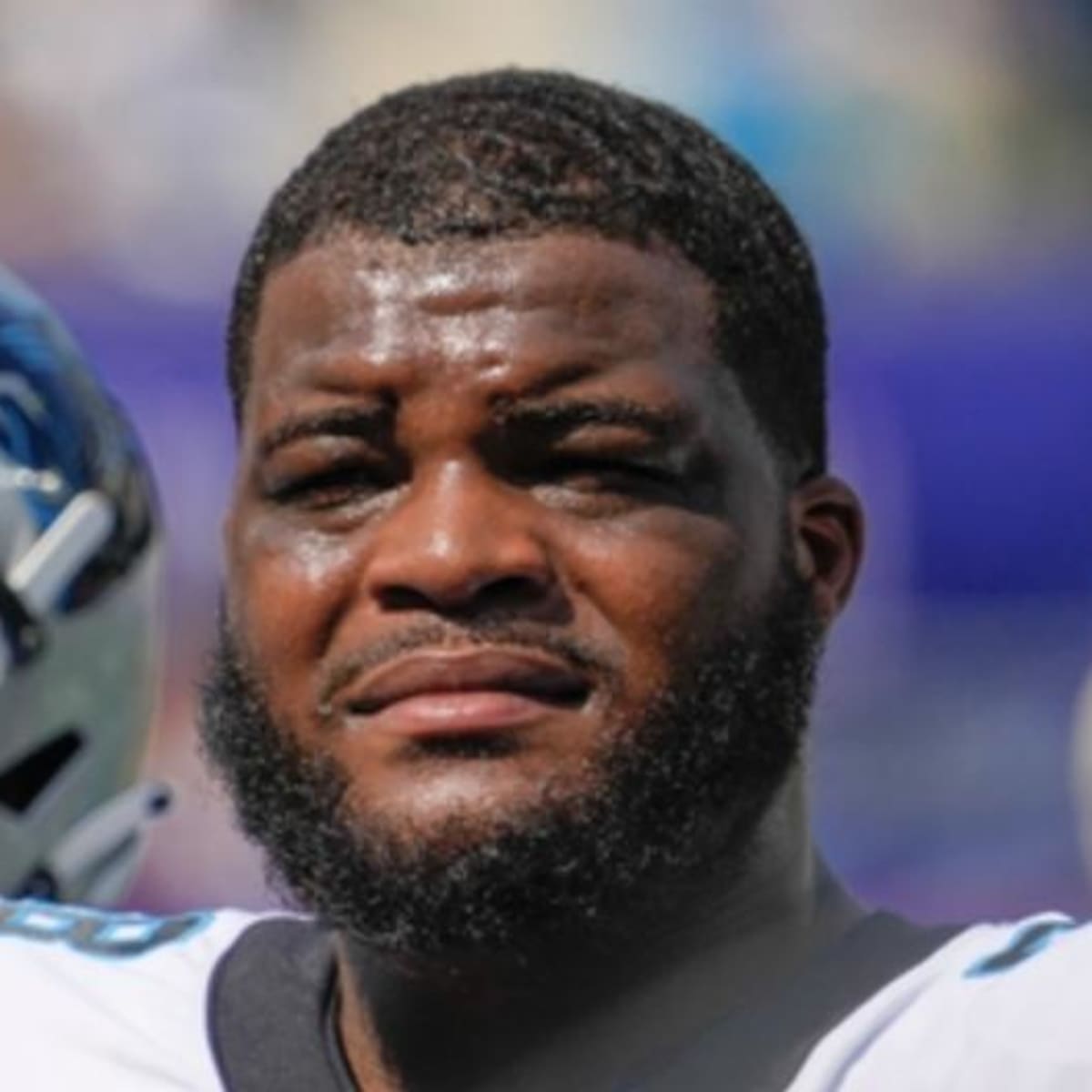 Carolina Panthers defensive tackle Marquan McCall (left) exchanges