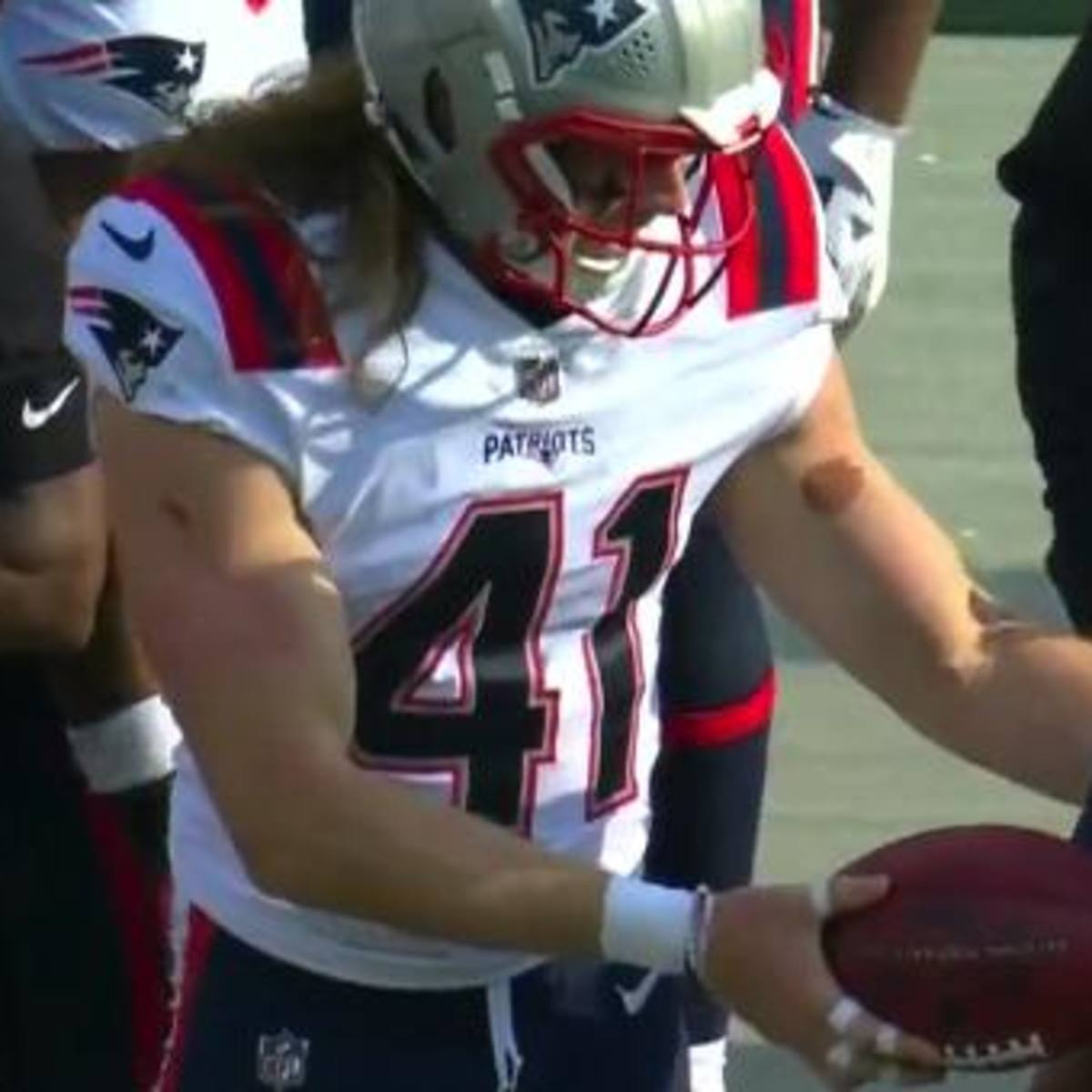 Patriots rookie Brenden Schooler tries to give football to Bill Belichick