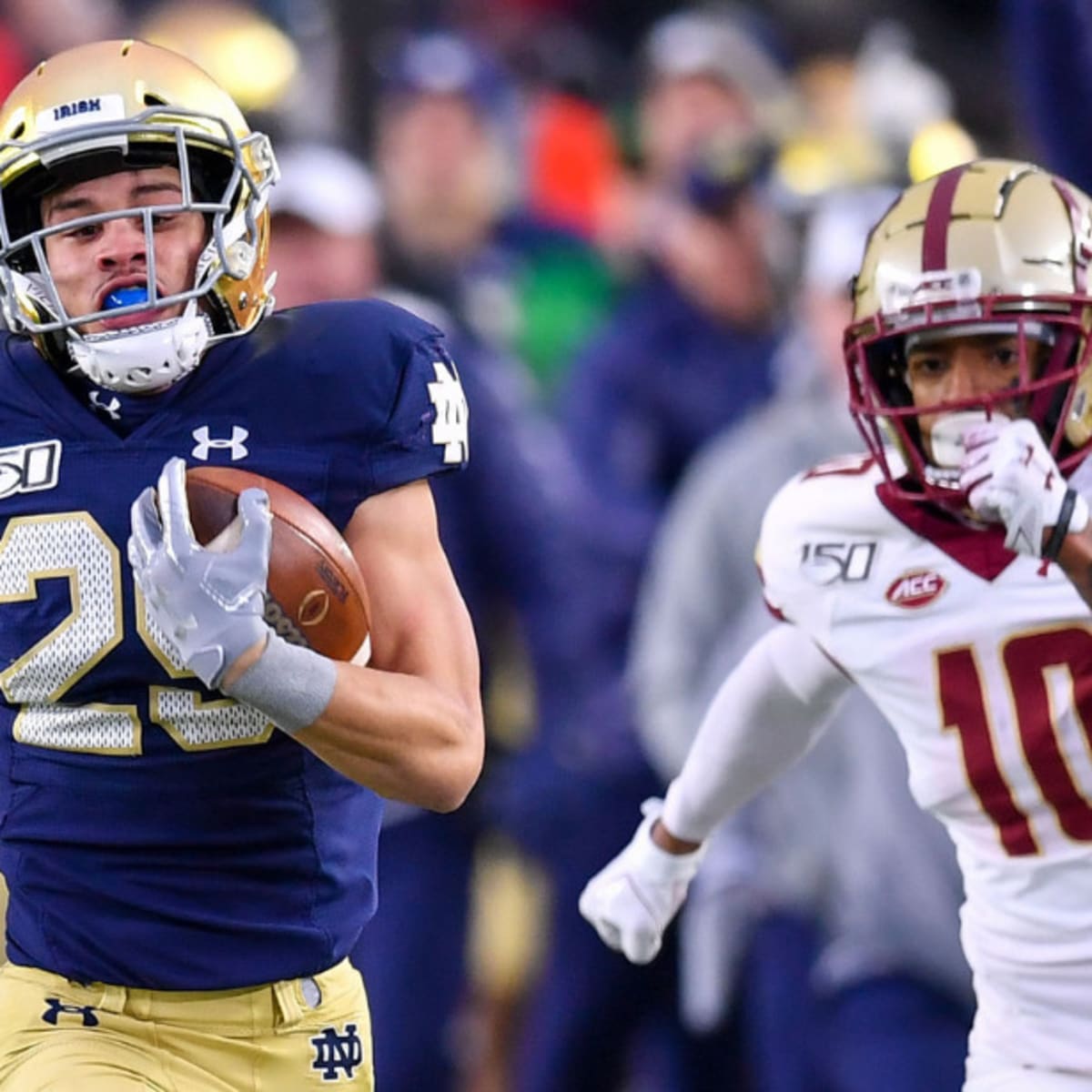 November 14, 2020; Chestnut Hill, MA, USA; Notre Dame Fighting Irish  quarterback Ian Book (12) in action during the NCAA football game between  Notre Dame Fighting Irish and Boston College Eagles at