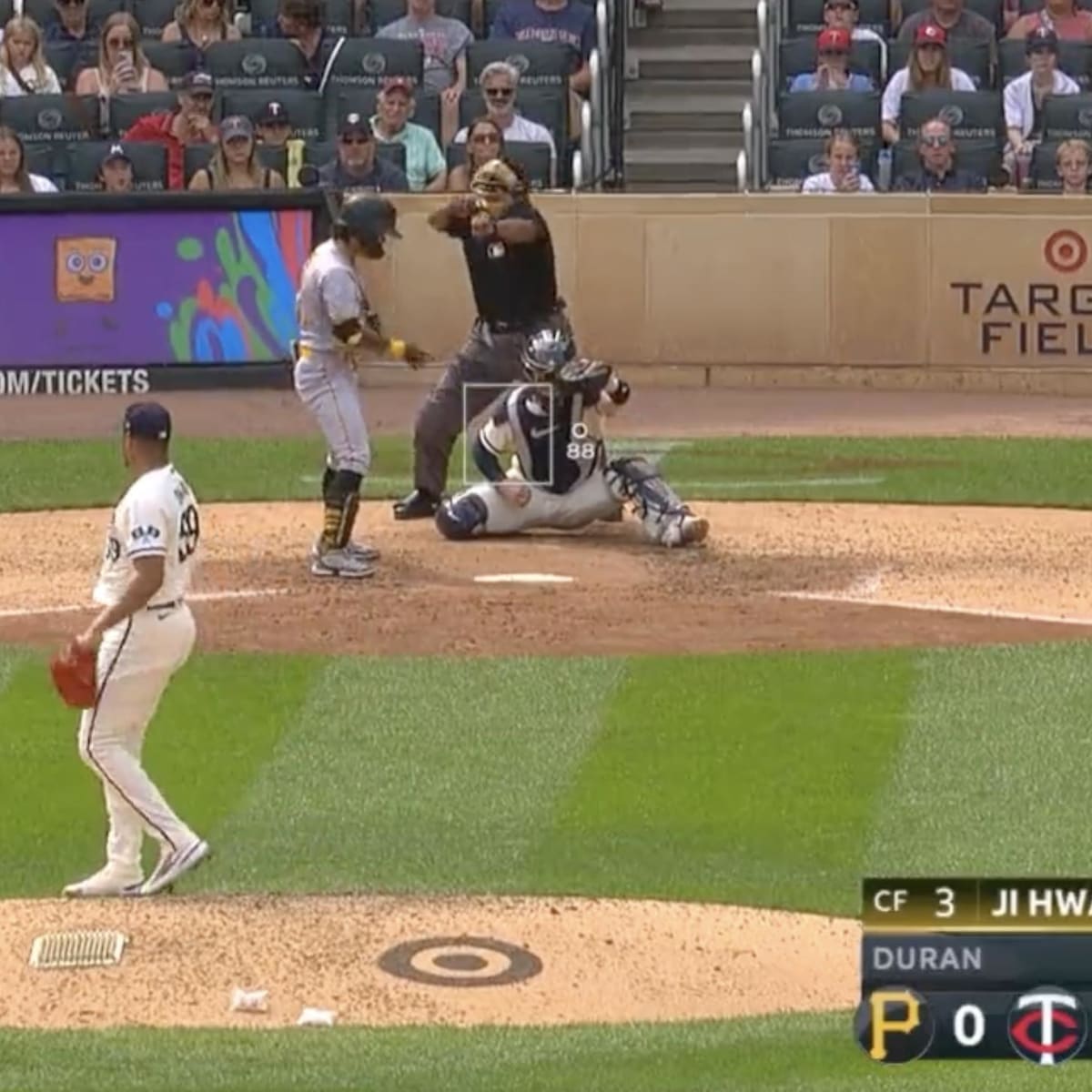 MLB umpire Laz Diaz looks to throw a baseball into the stands