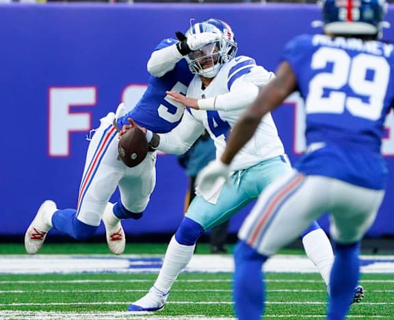 New York Giants linebacker Lorenzo Carter (59) sacks Dallas Cowboys quarterback Dak Prescott (4) for a fumble and Giants recovery in the second half at MetLife Stadium. The Giants fall to the Cowboys, 21-6, on Sunday, Dec. 19, 2021, in East Rutherford.