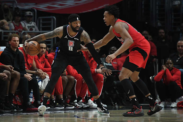 Los Angeles Clippers forward Marcus Morris Sr. (8) controls the ball against Toronto Raptors forward Scottie Barnes (4) during the second half at Crypto.com Arena