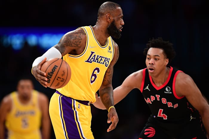 Los Angeles Lakers forward LeBron James (6) controls the ball against Toronto Raptors forward Scottie Barnes (4) during the first half at Crypto.com Arena