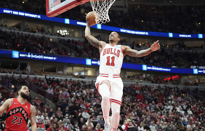 Chicago Bulls forward DeMar DeRozan (11) goes up for a dunk against the Toronto Raptors during the first quarter at United Center