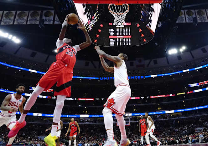 Chicago Bulls forward DeMar DeRozan (11) defends Toronto Raptors forward Chris Boucher (25) during the first quarter at United Center