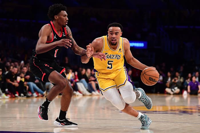 Los Angeles Lakers guard Talen Horton-Tucker (5) moves the ball against Toronto Raptors guard Armoni Brooks (1) during the second half at Crypto.com Arena.