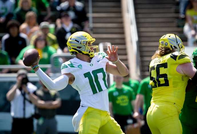 Yellow Team quarterback Bo Nix (10) throws out a pass during the Oregon Spring Game Saturday, April 23, 2022, at Autzen Stadium.