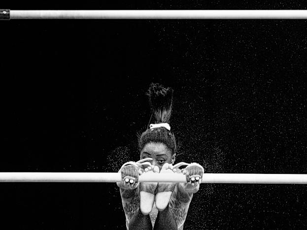 Biles competing on the uneven bars in 2018.