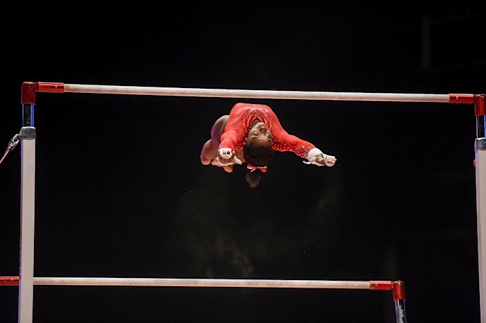 Biles on the uneven bars at the 2015 World Gymnastics Championships.