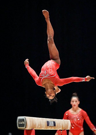 Biles competing on the balance beam at the 2015 World Gymnastics Championships.