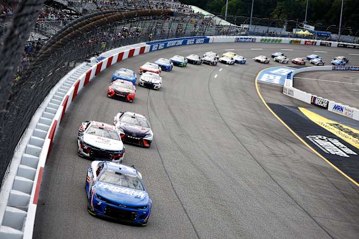 Kyle Larson, driver of the No. 5 HendrickCars.com Chevrolet, leads William Byron, driver of the No. 24 Liberty University Chevrolet, and Denny Hamlin, driver of the No. 11 FedEx Freight Toyota, race during Sunday's NASCAR Cup Series Federated Auto Parts 400 at Richmond Raceway. (Photo by Jared C. Tilton/Getty Images)