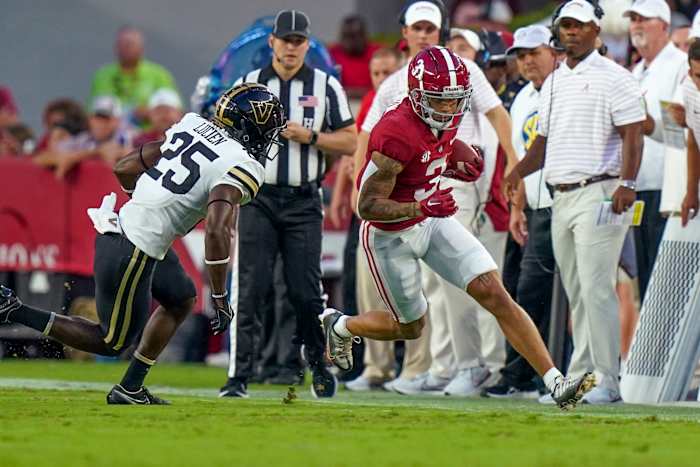 Alabama Crimson Tide wide receiver Jermaine Burton (3) carries the ball against Vanderbilt Commodores cornerback Jeremy Lucien (25) during the first half at Bryant-Denny Stadium.