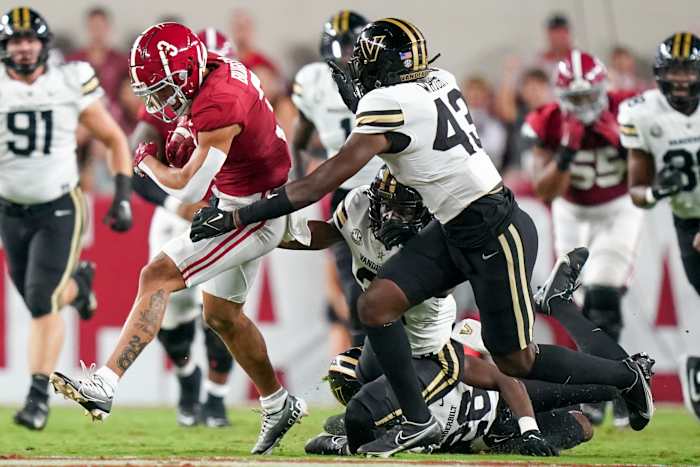 Alabama Crimson Tide wide receiver Jermaine Burton carries the ball against Vanderbilt Commodores after a catch during the first half at Bryant-Denny Stadium.