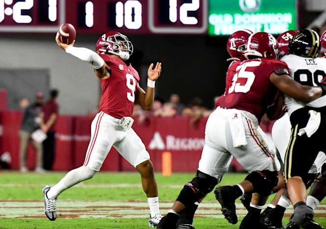 Alabama Crimson Tide quarterback Bryce Young (9) throws a touchdown pass against the Vanderbilt Commodores at Bryant-Denny Stadium.