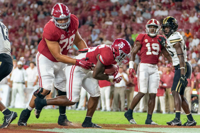 Alabama Crimson Tide running back Jamarion Miller (26) scores a touchdown against the Vanderbilt Commodores during the second half at Bryant-Denny Stadium.