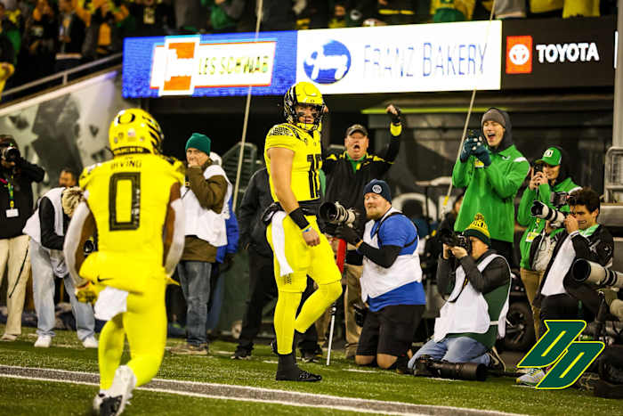 Oregon Ducks quarterback Bo Nix scores a touchdown against the Washington Huskies.