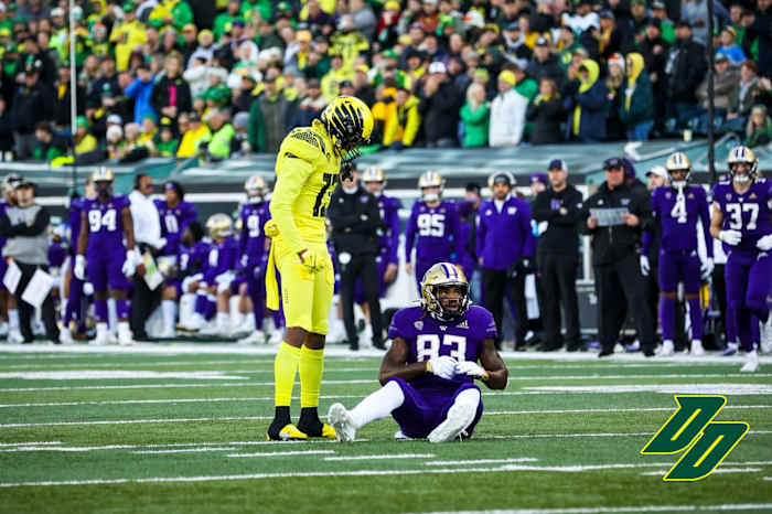 Oregon Ducks safety Bryan Addison stares down Washington Huskies tight end Devin Culp.