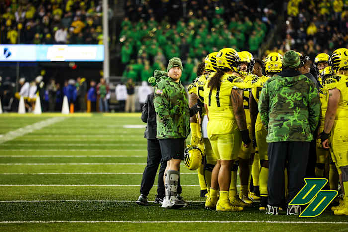 Oregon Ducks offensive lineman Ryan Walk sports a walking boot after getting injured against Washington.