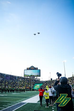 Fighter jets fly over Autzen Stadium before kickoff in Eugene.